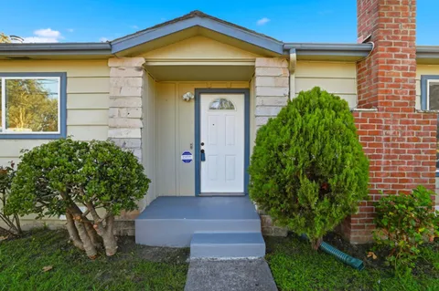 a front view of a house with garden