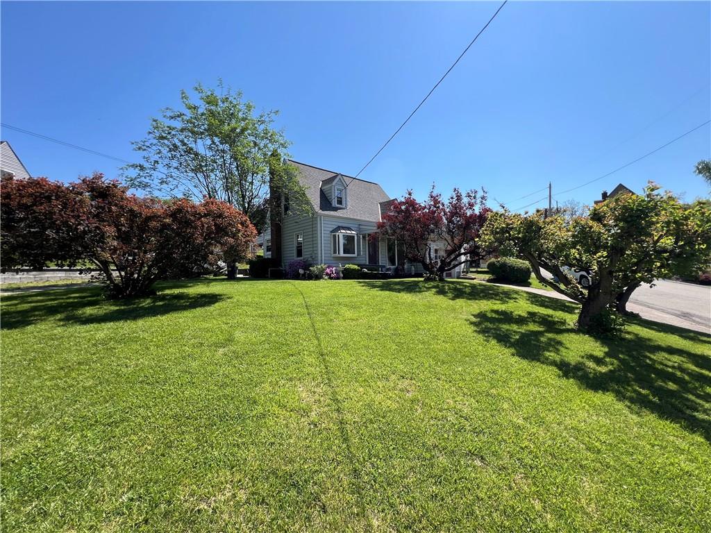 413 Rustic Road North Versailles, PA 15137 - Photo 1 of 20 a view of a house with a big yard