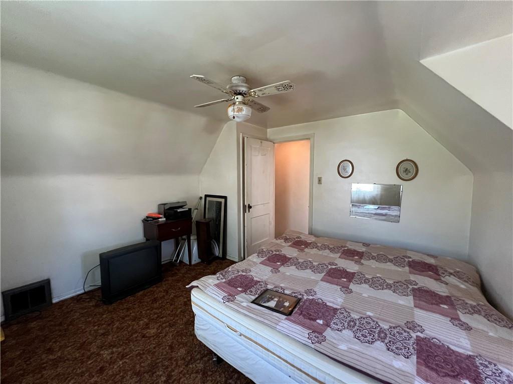 413 Rustic Road North Versailles, PA 15137 - Photo 14 of 20 a bedroom with a bed and a table in it