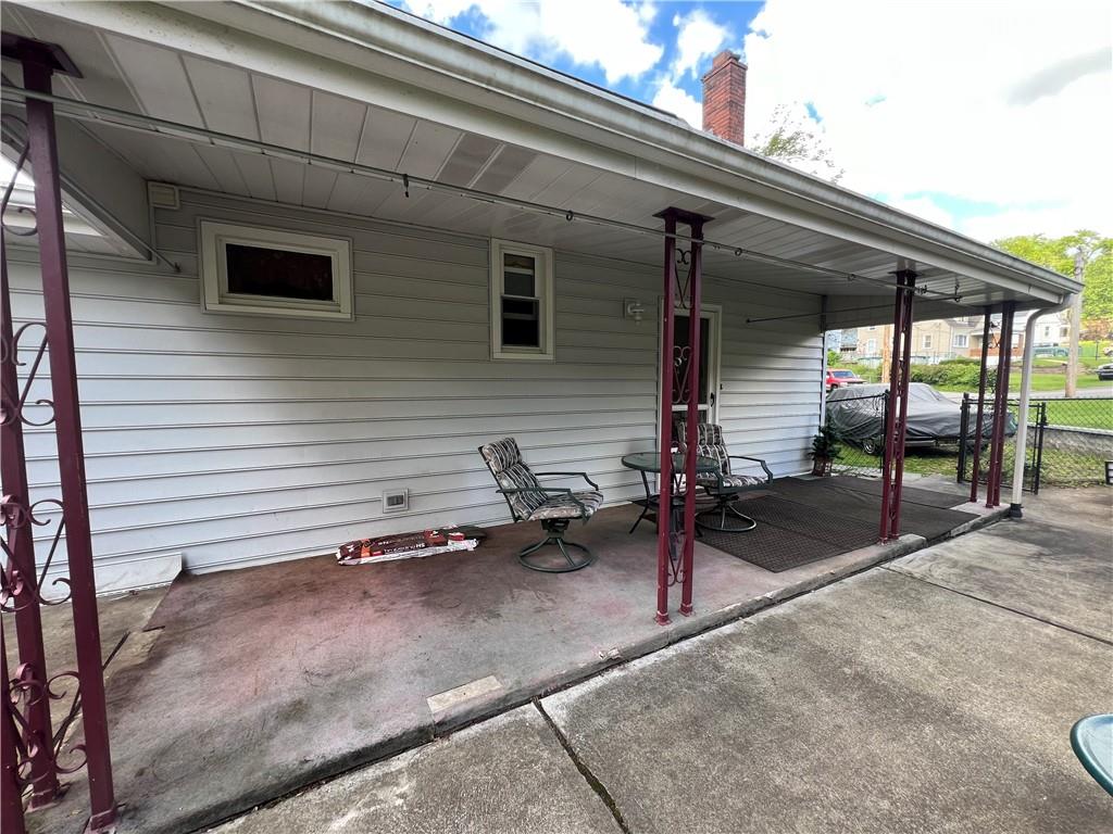 413 Rustic Road North Versailles, PA 15137 - Photo 19 of 20 a backyard of a house with table and chairs