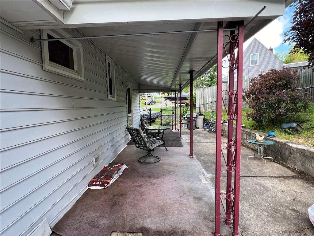 413 Rustic Road North Versailles, PA 15137 - Photo 20 of 20 a patio with table and chairs and potted plants
