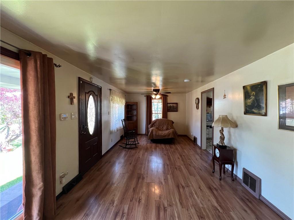 413 Rustic Road North Versailles, PA 15137 - Photo 7 of 20 a living room with furniture and a wooden floor