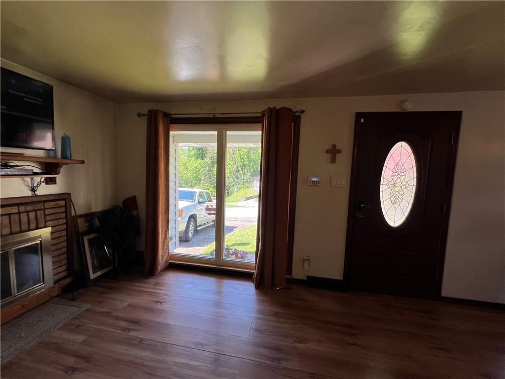 413 Rustic Road North Versailles, PA 15137 - Photo 9 of 20 an empty room with wooden floor mirror and windows