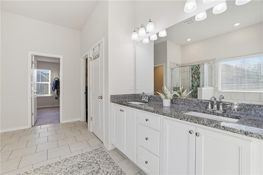 175 Paxton Lane Jefferson, GA 30549 - Photo 18 of 39 a bathroom with double sink and a mirror