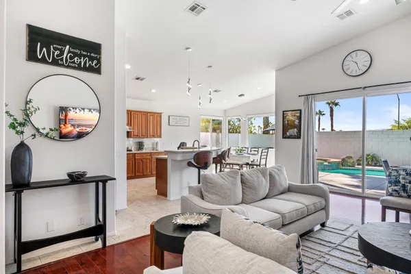 a living room with furniture and a large window