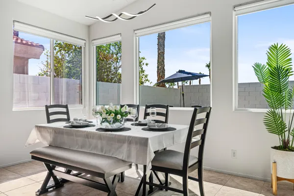 a dining room with furniture and window