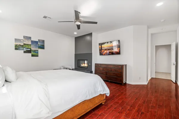 a bedroom with a bed and a fireplace