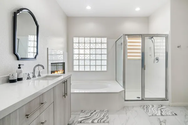 a bathroom with a bathtub and a sink
