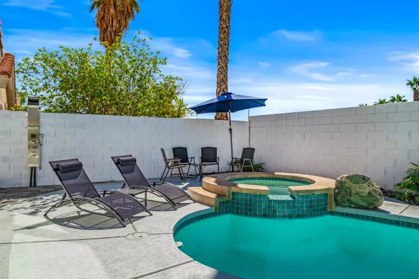 a view of a swimming pool with a patio