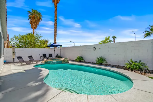 a view of a backyard with a garden and plants
