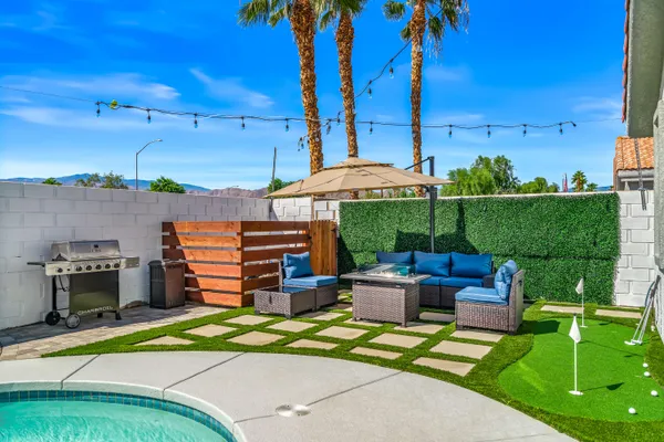 an outdoor space with patio furniture