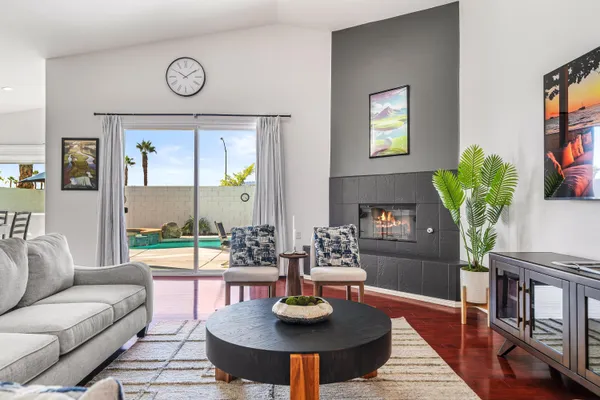 a living room with furniture and a table