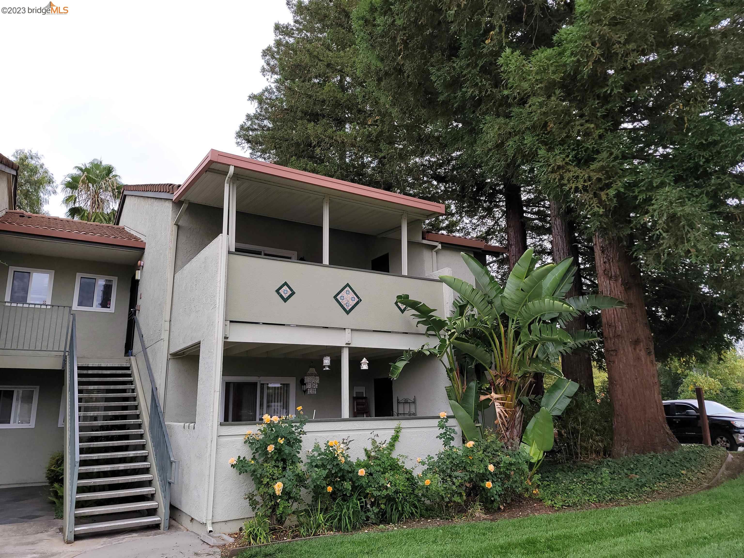 1505 Kirker Pass Road, Unit 207 Concord, CA 94521 - Photo 1 of 1 a front view of a house with garden