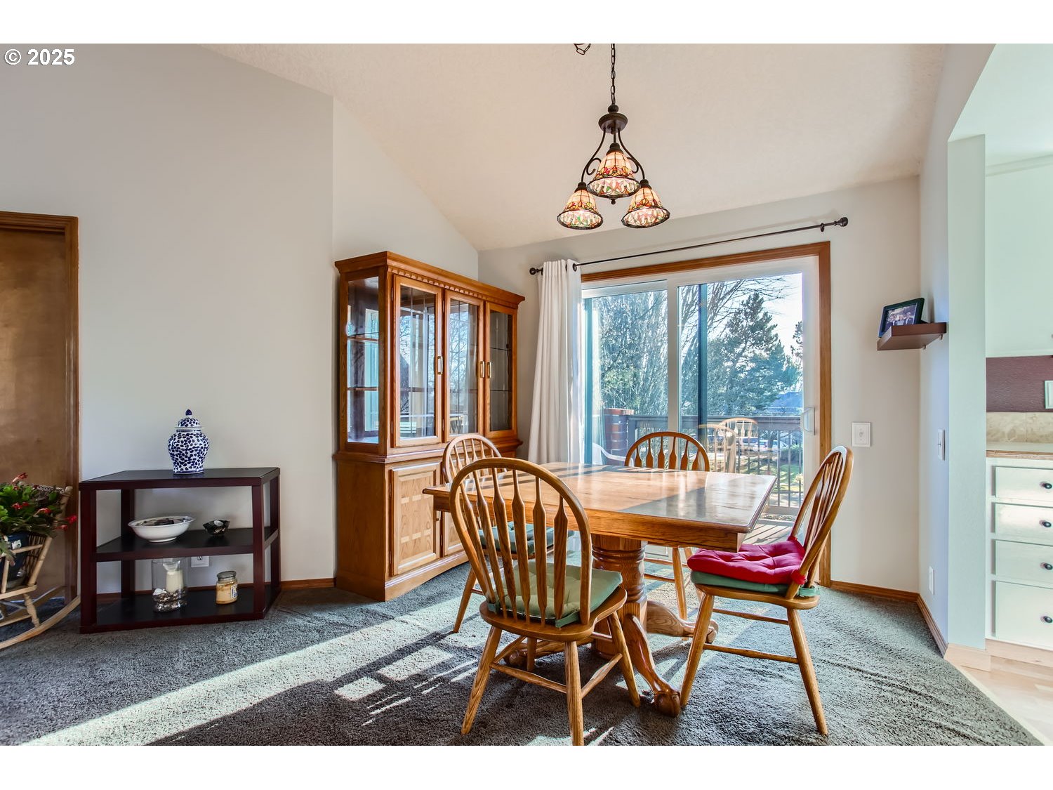 15655 Southwest 114th Court, Unit 10 Portland, OR 97224 - Photo 11 of 27 a view of a dining room with furniture window and outside view