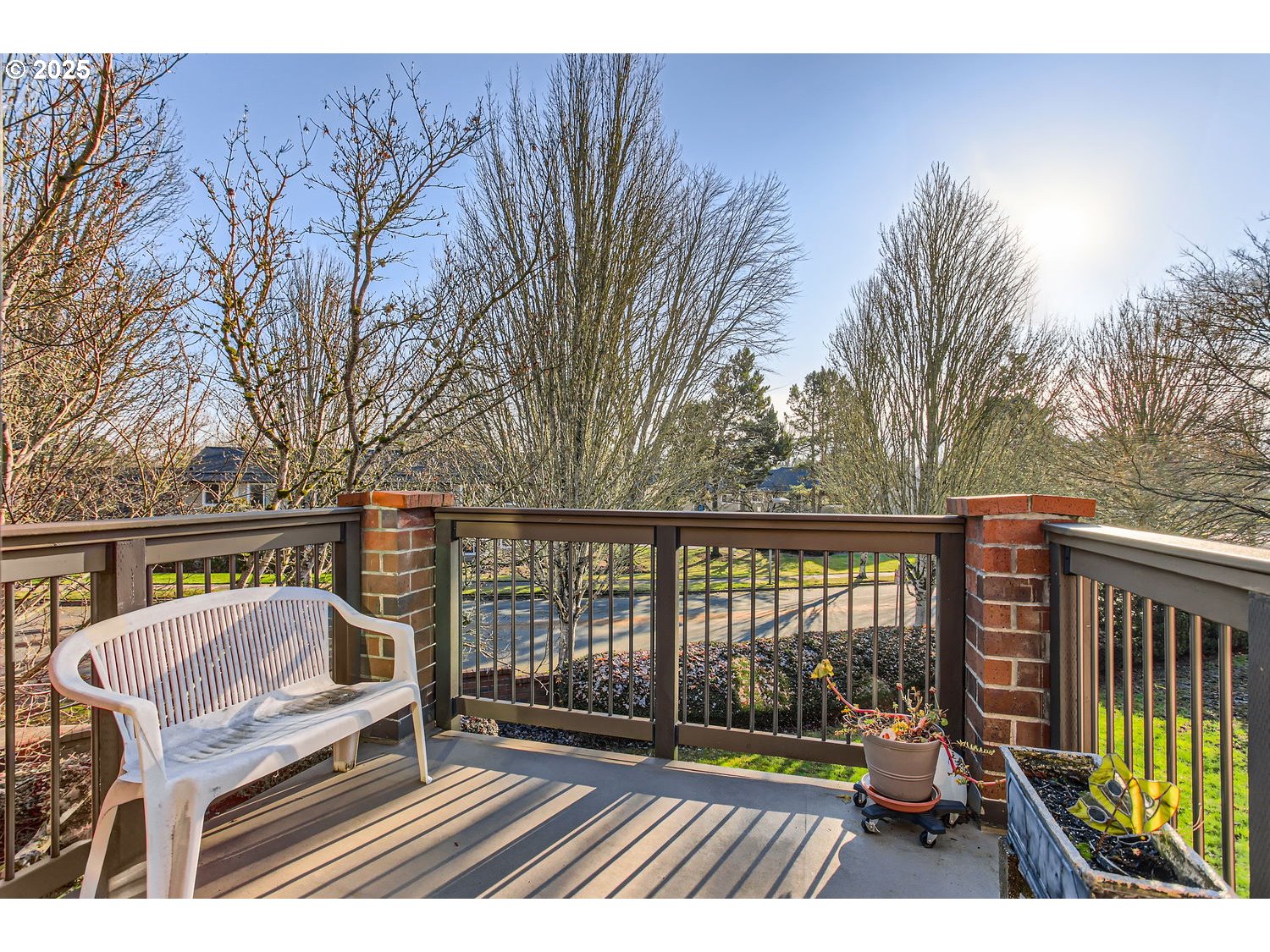 15655 Southwest 114th Court, Unit 10 Portland, OR 97224 - Photo 12 of 27 a view of balcony with wooden floor and outdoor seating