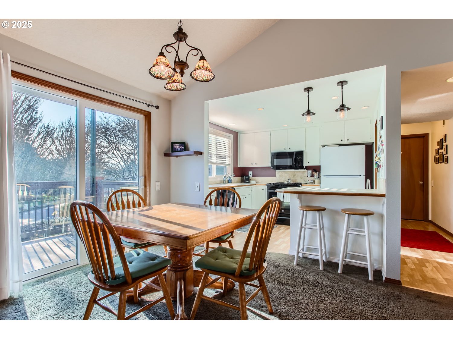 15655 Southwest 114th Court, Unit 10 Portland, OR 97224 - Photo 13 of 27 a view of a dining room with furniture window and outside view