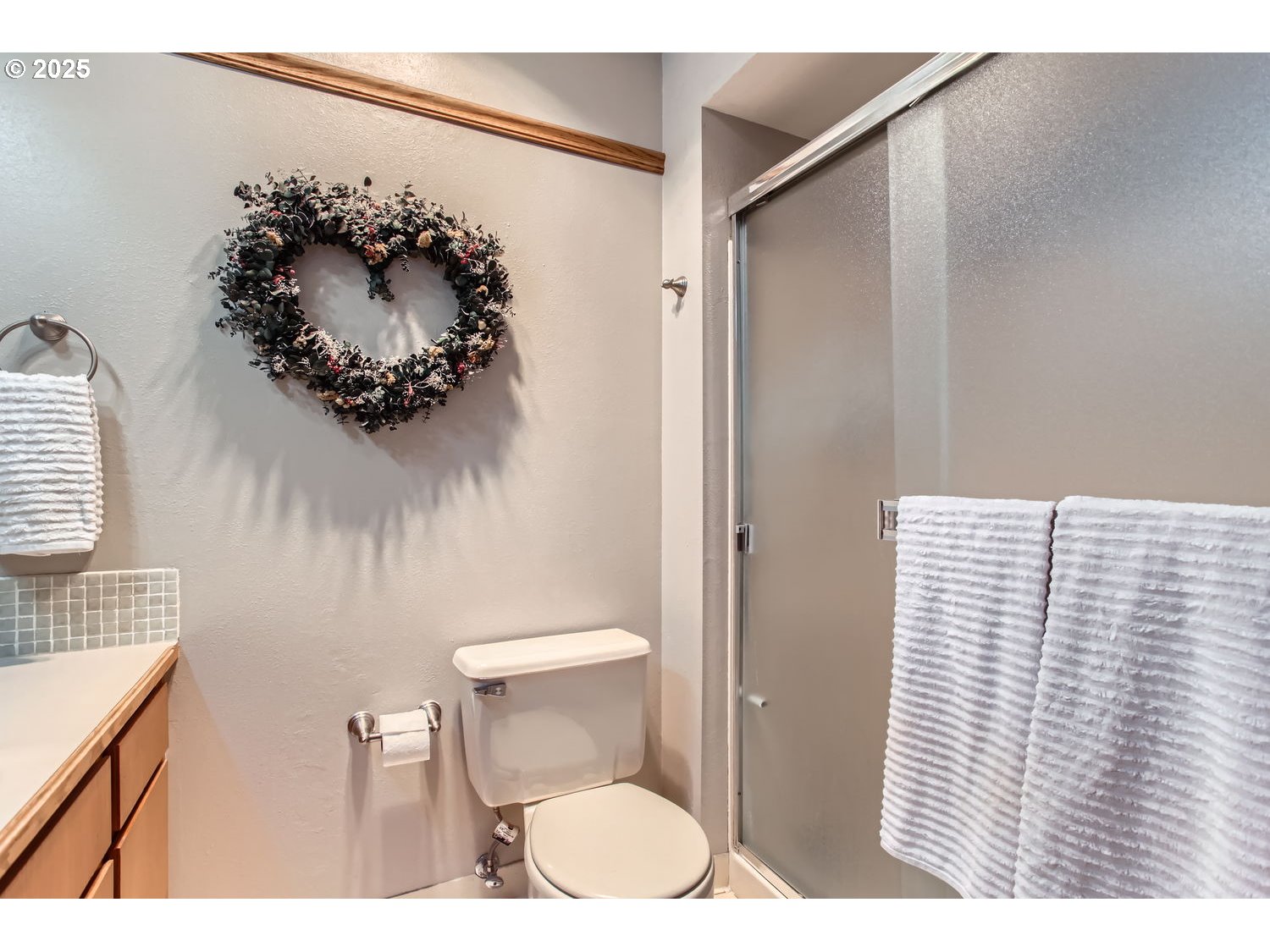 15655 Southwest 114th Court, Unit 10 Portland, OR 97224 - Photo 22 of 27 a bathroom with a toilet sink and vanity