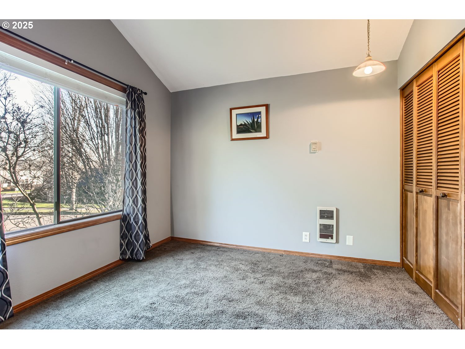 15655 Southwest 114th Court, Unit 10 Portland, OR 97224 - Photo 23 of 27 a view of an empty room with a window