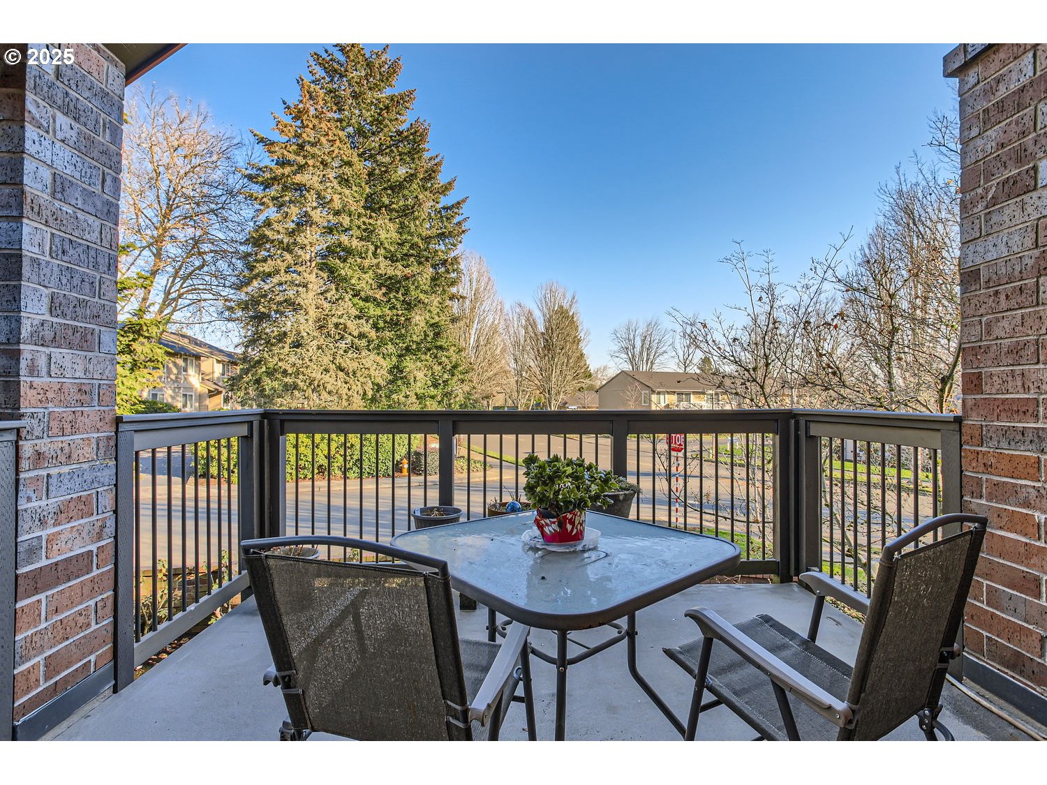 15655 Southwest 114th Court, Unit 10 Portland, OR 97224 - Photo 7 of 27 a balcony with table and chairs