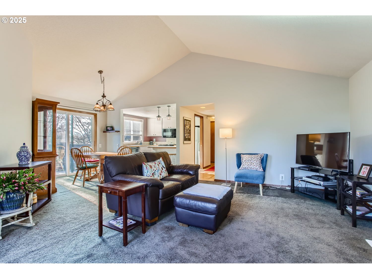 15655 Southwest 114th Court, Unit 10 Portland, OR 97224 - Photo 8 of 27 a living room with furniture and a flat screen tv