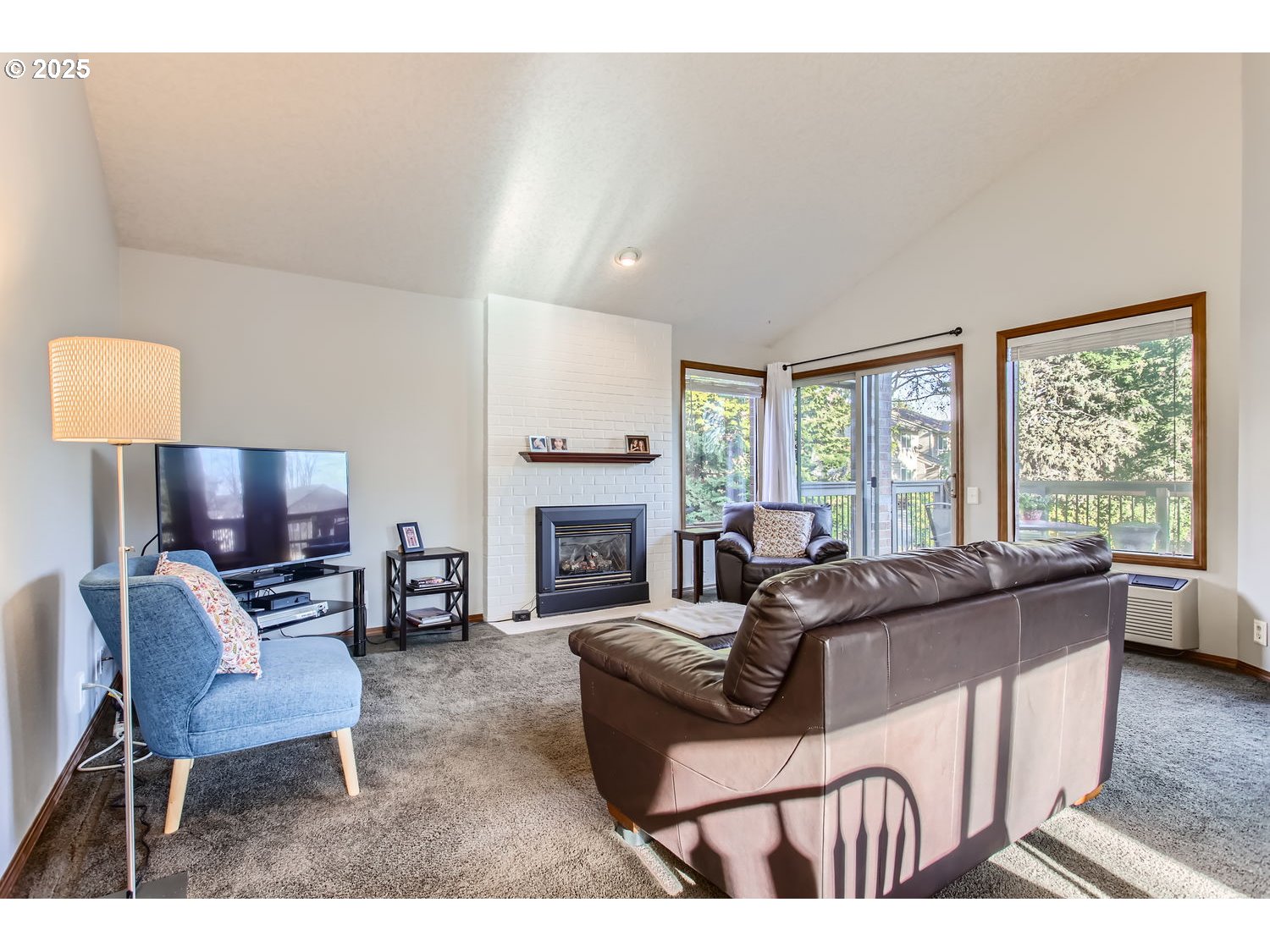 15655 Southwest 114th Court, Unit 10 Portland, OR 97224 - Photo 10 of 27 a living room with fireplace furniture and a large window