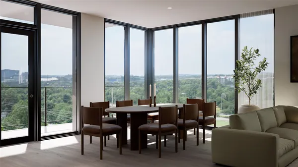 a living room with furniture and a floor to ceiling window