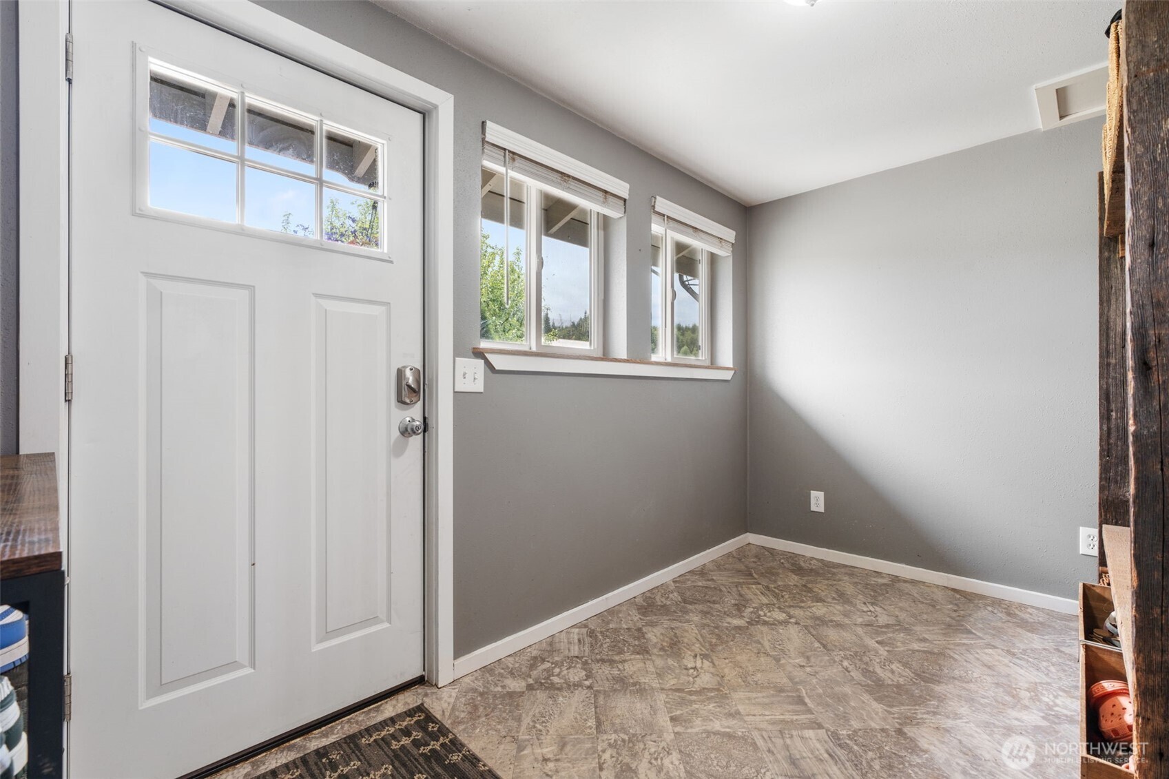 2163 Wildwood Road Curtis, WA 98538 - Photo 11 of 36 a view of a livingroom with wooden floor and a window