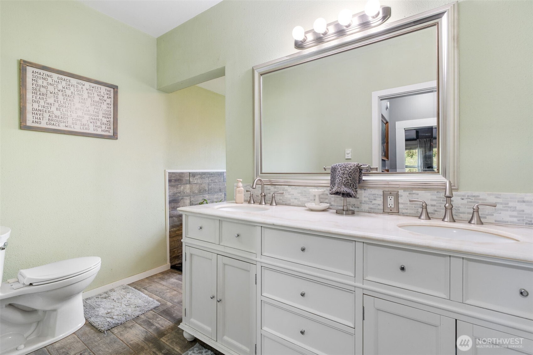 2163 Wildwood Road Curtis, WA 98538 - Photo 14 of 36 a view of bathroom with a toilet sink and mirror