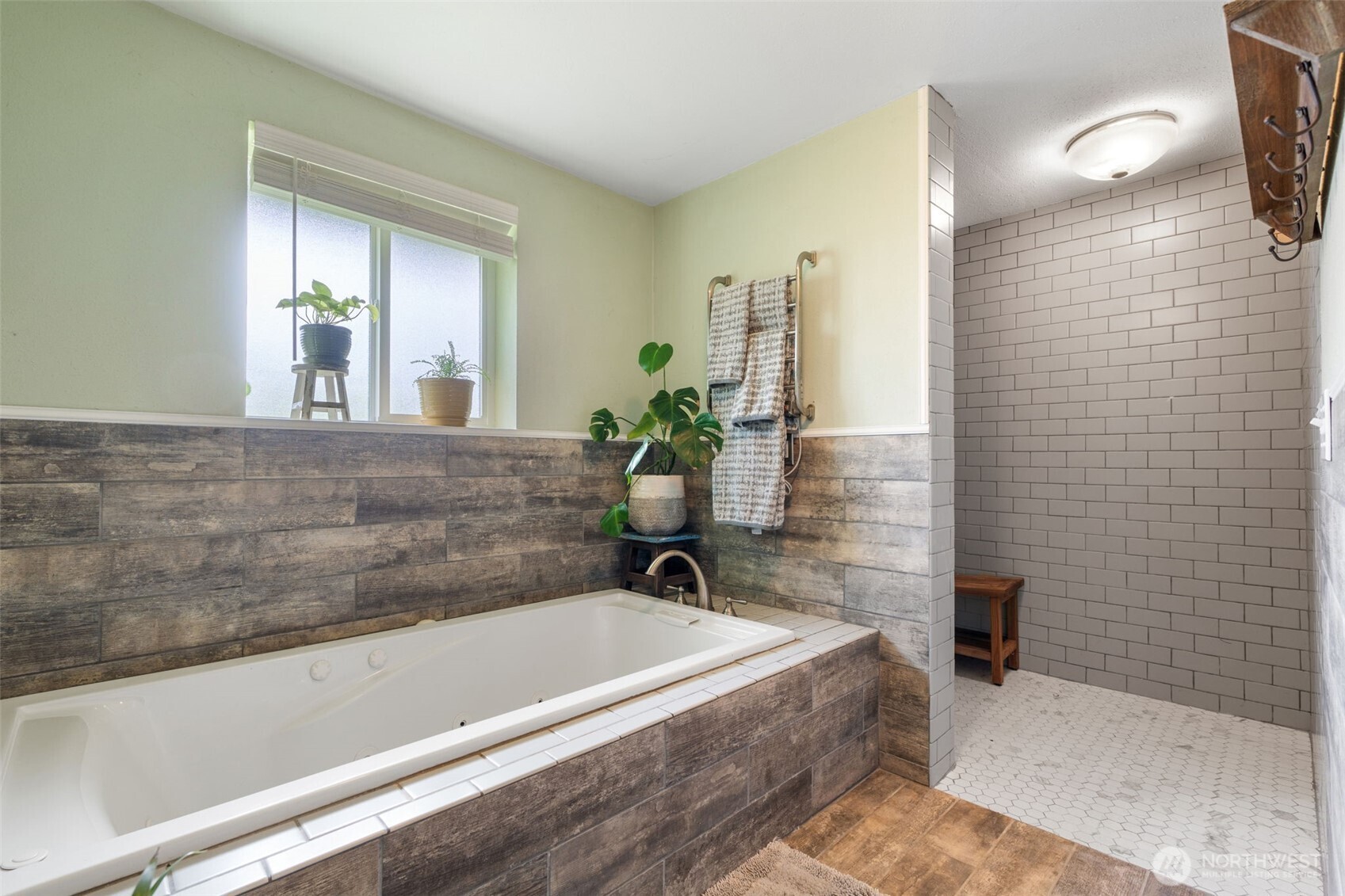 2163 Wildwood Road Curtis, WA 98538 - Photo 15 of 36 a bath tub sitting in a bathroom next to a window