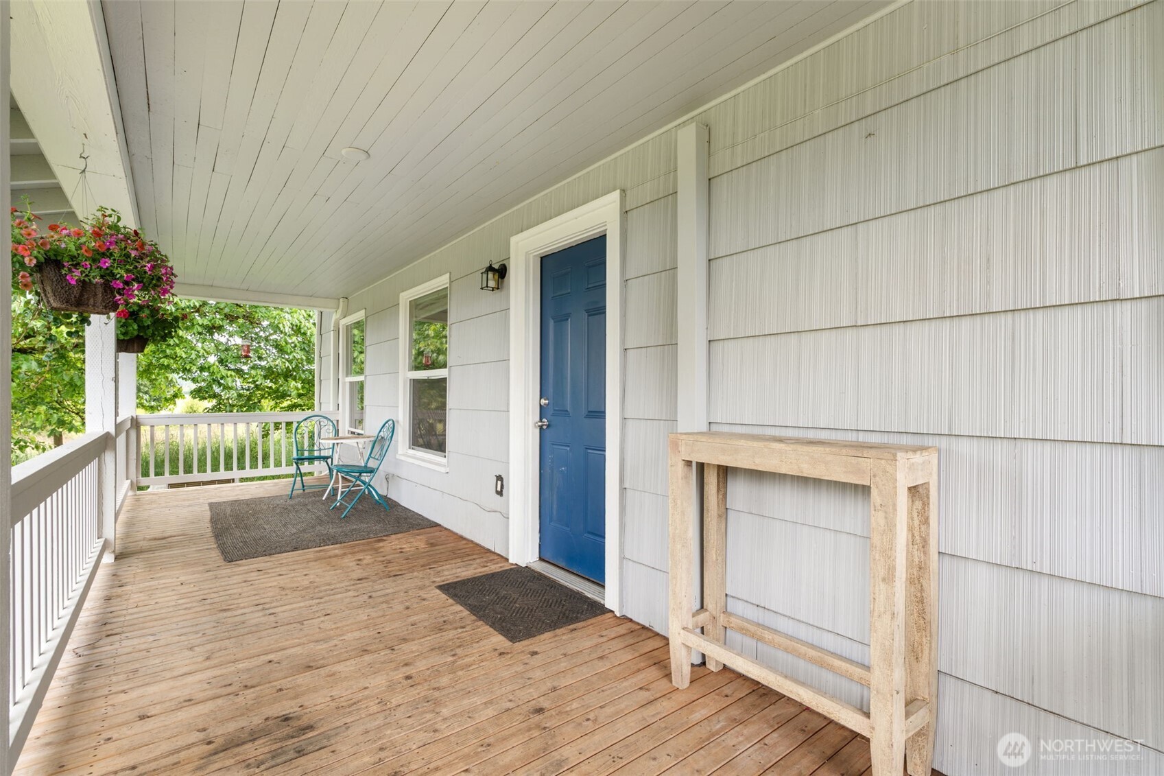 2163 Wildwood Road Curtis, WA 98538 - Photo 22 of 36 a view of a hallway with wooden floor and a fireplace