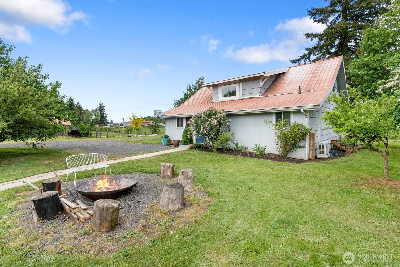 2163 Wildwood Road Curtis, WA 98538 - Photo 25 of 36 a view of a house with a yard and a patio