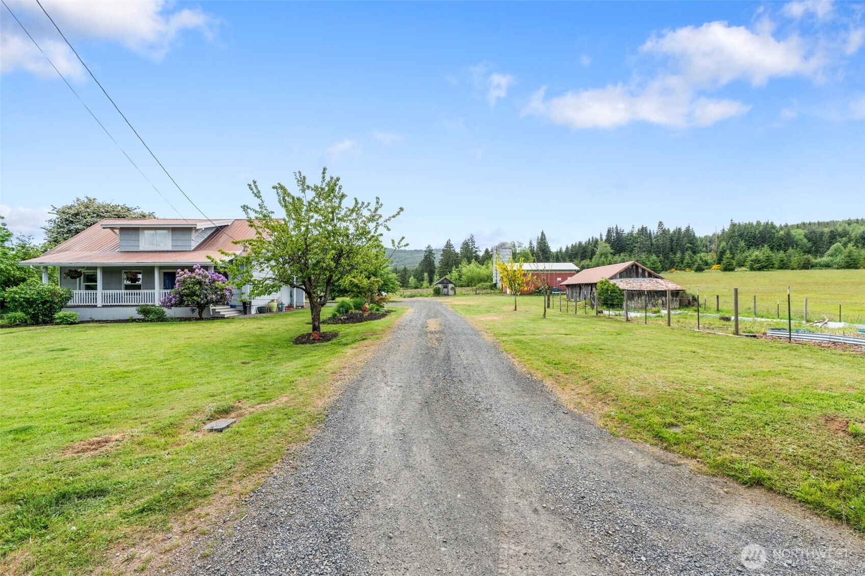2163 Wildwood Road Curtis, WA 98538 - Photo 29 of 36 a view of a house with garden and a pond