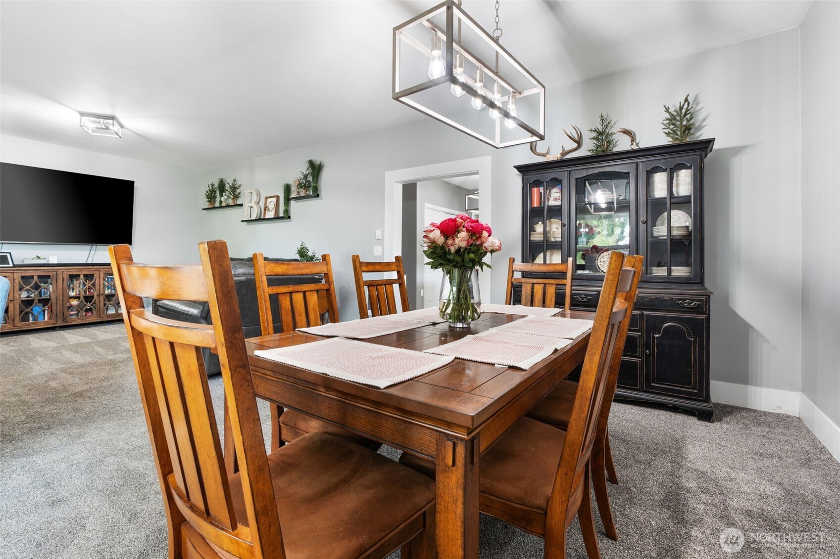2163 Wildwood Road Curtis, WA 98538 - Photo 6 of 36 a view of a dining room with furniture and a chandelier