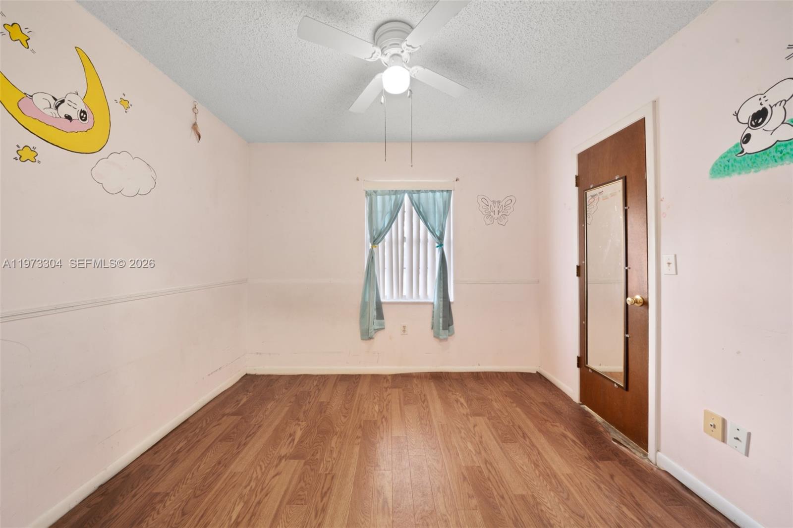 2067 North Terrapin Road Avon Park, FL 33825 - Photo 20 of 43 a view of empty room with wooden floor and fan