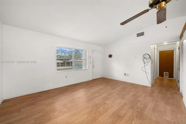 a view of an empty room with a window