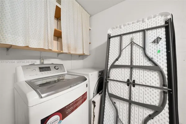 a utility room with dryer and washer