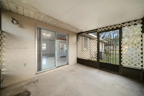 a view of an empty room and window