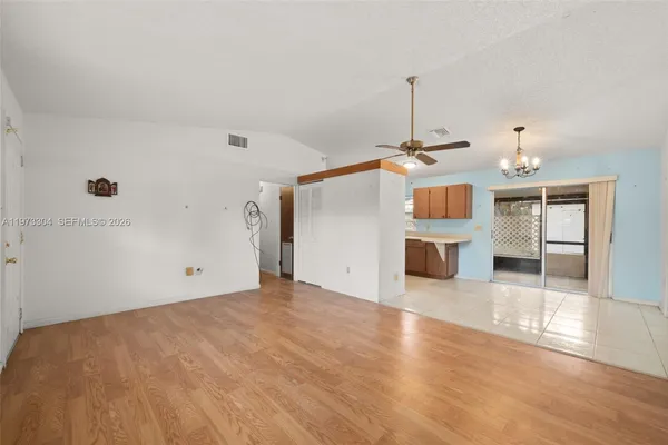 a view of a kitchen with a sink and cabinet