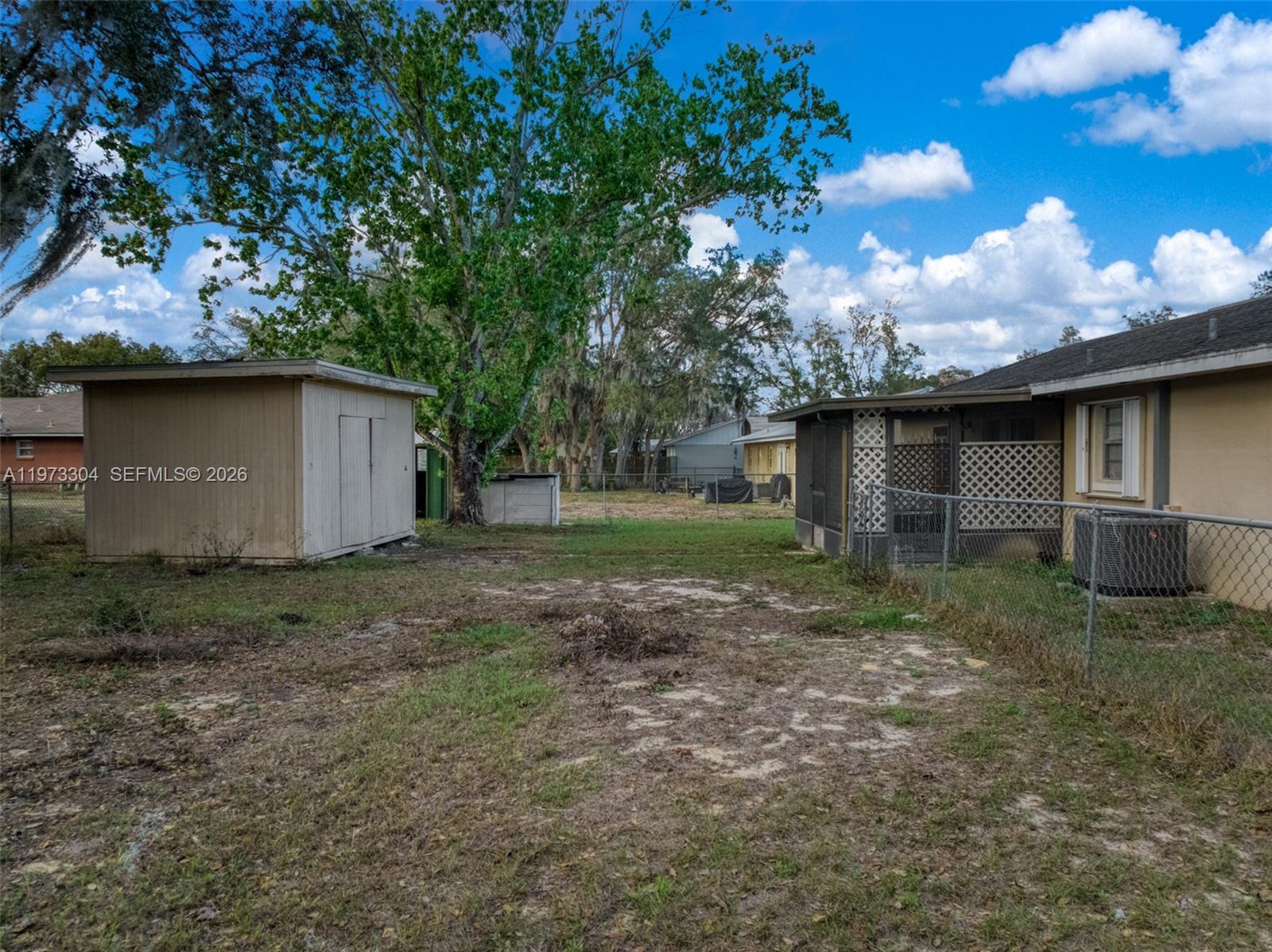 2067 North Terrapin Road Avon Park, FL 33825 - Photo 32 of 43 a view of a house with backyard