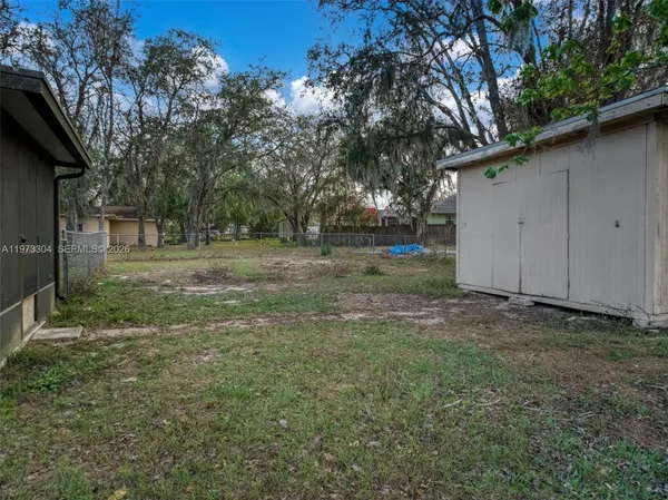 a backyard of a house with lots of green space