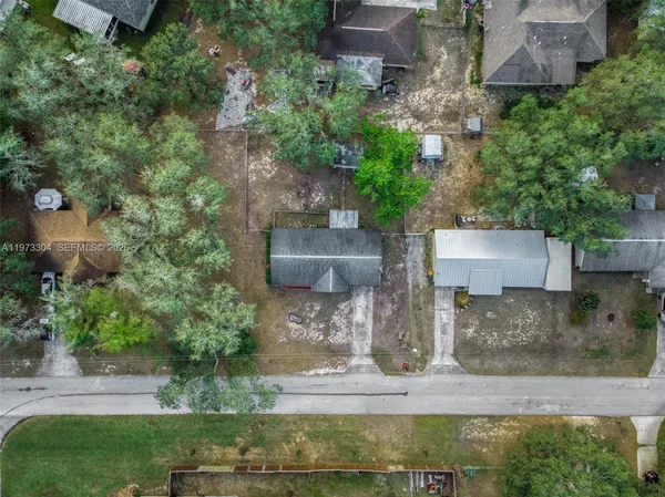 an aerial view of a house with outdoor space