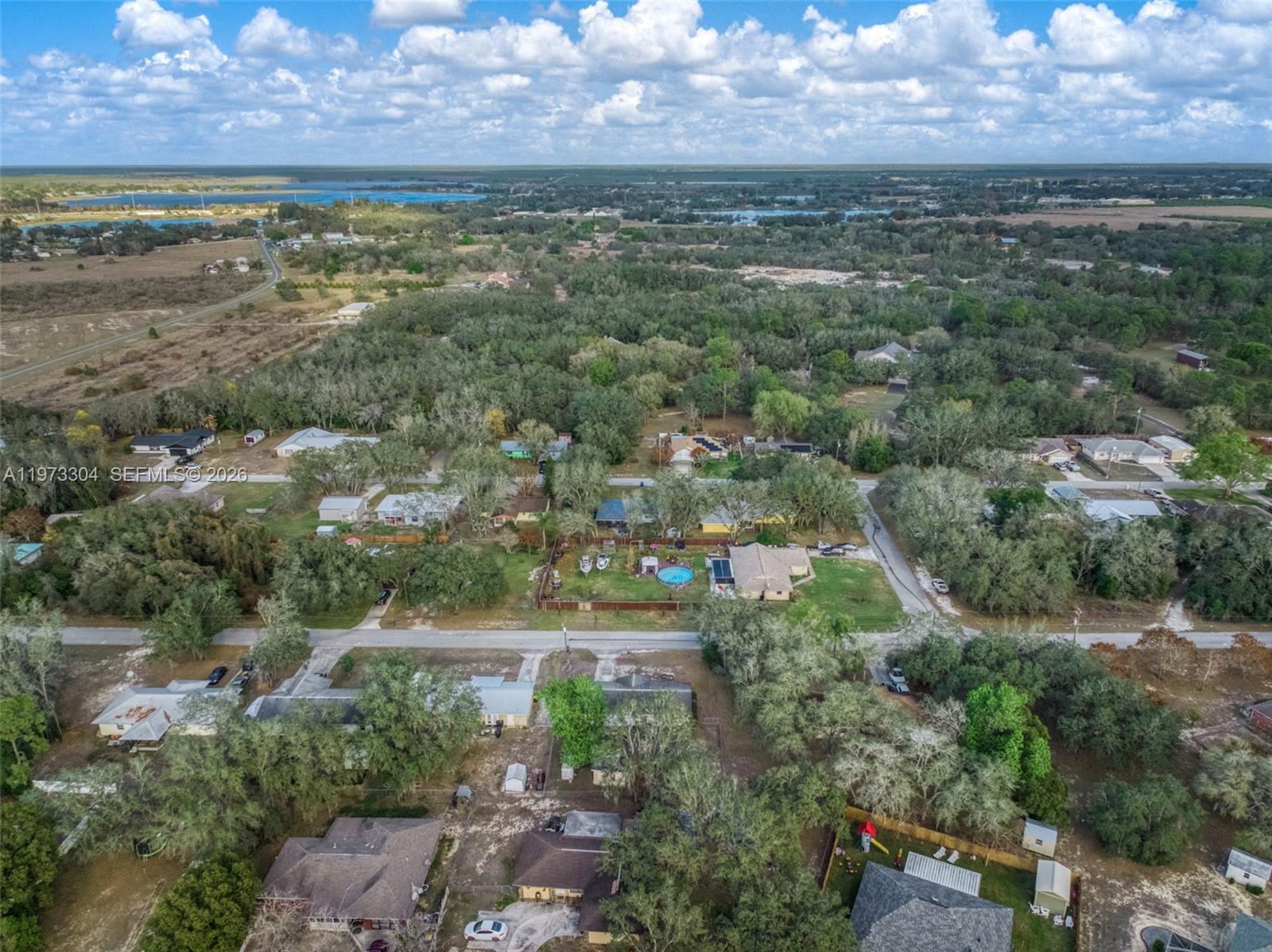 2067 North Terrapin Road Avon Park, FL 33825 - Photo 42 of 43 an aerial view of residential houses with outdoor space and lake view