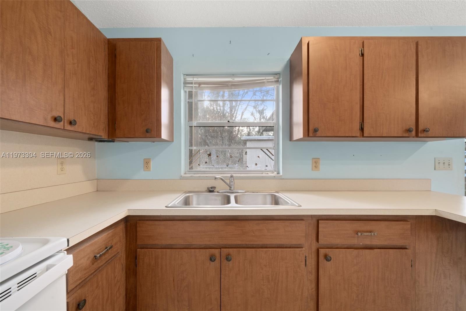 2067 North Terrapin Road Avon Park, FL 33825 - Photo 8 of 43 a kitchen with a sink cabinets and a window