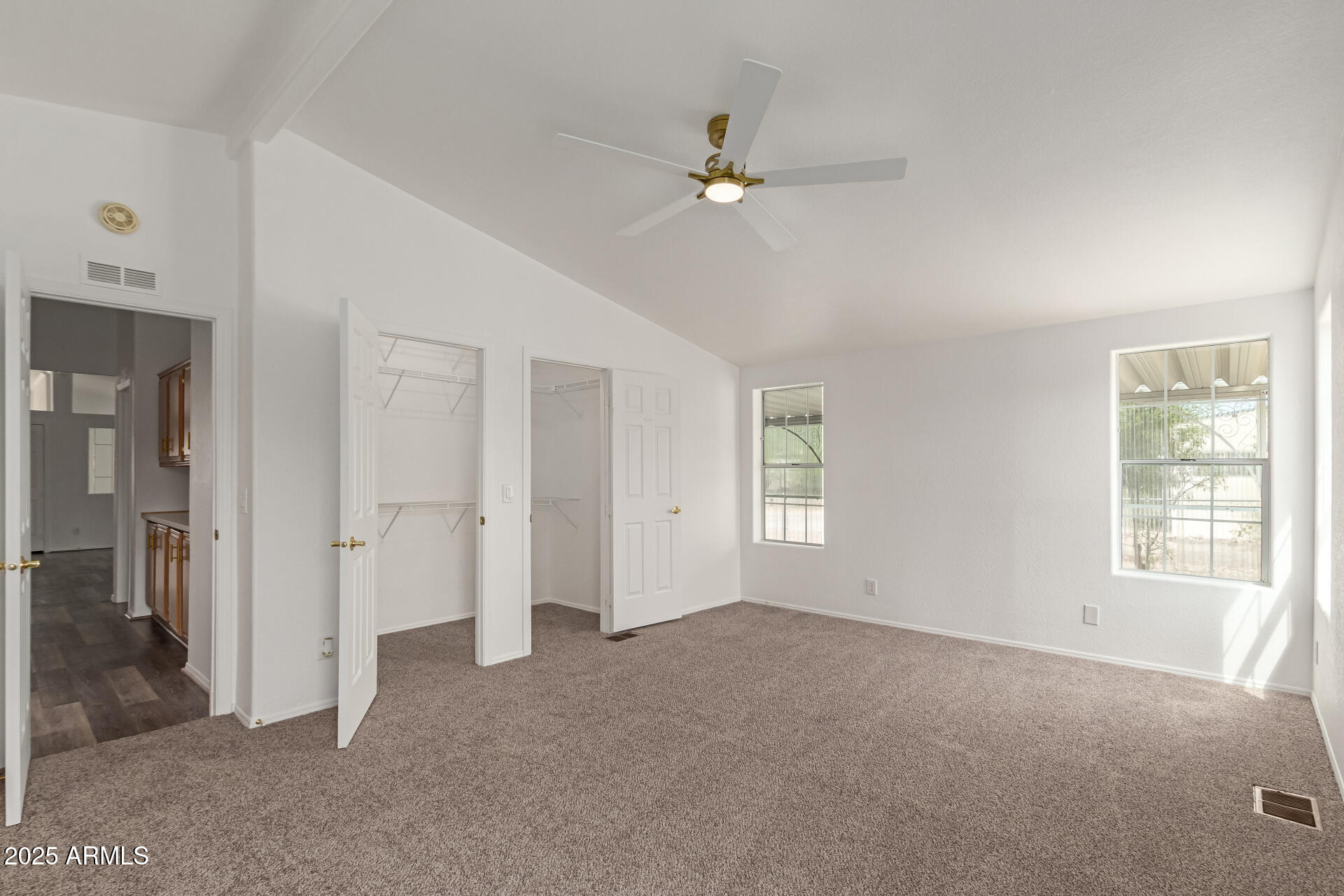 2311 South Descanso Road Apache Junction, AZ 85119 - Photo 17 of 35 a view of an empty room with chandelier fan and fire place