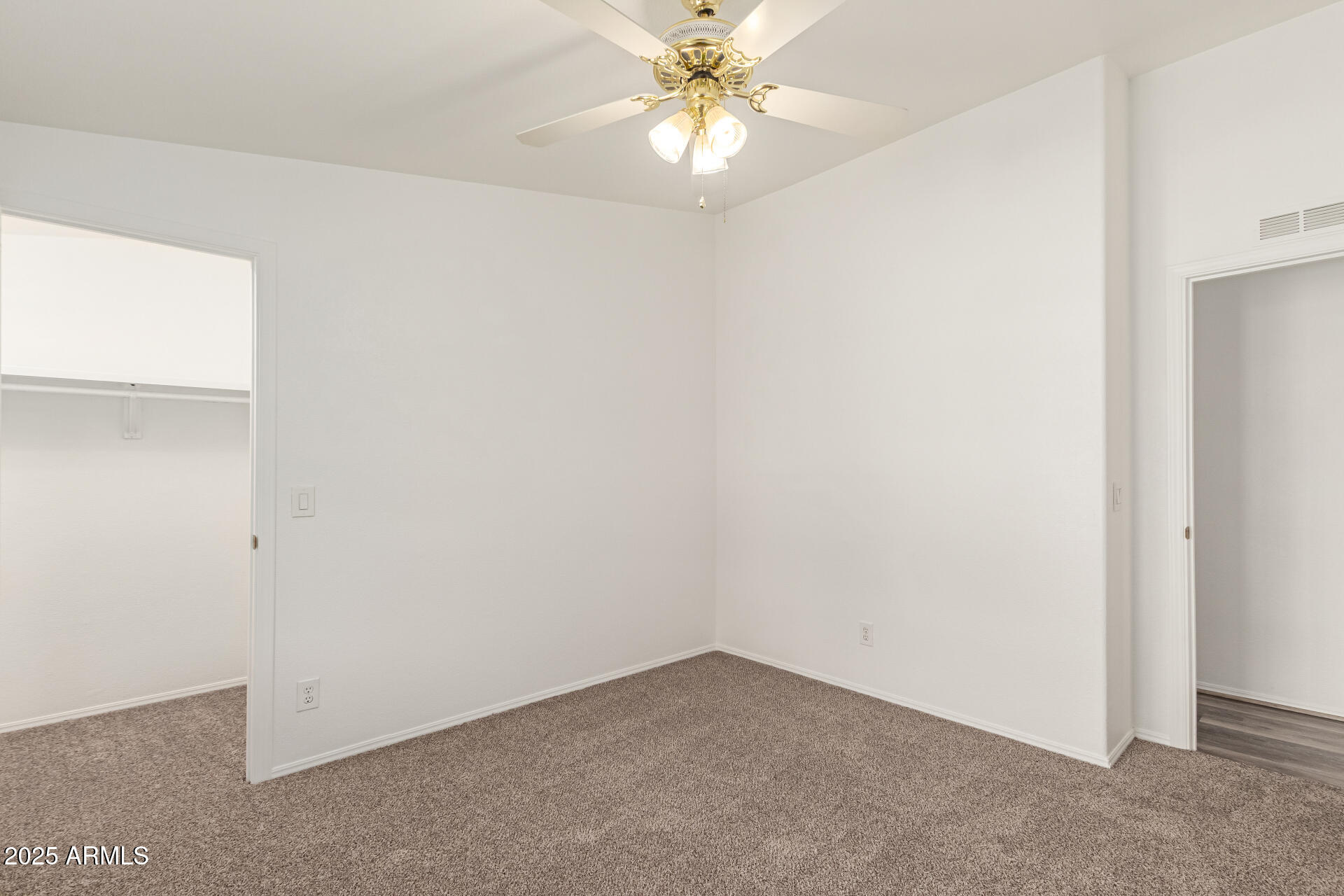 2311 South Descanso Road Apache Junction, AZ 85119 - Photo 24 of 35 an empty room with a window and a fan