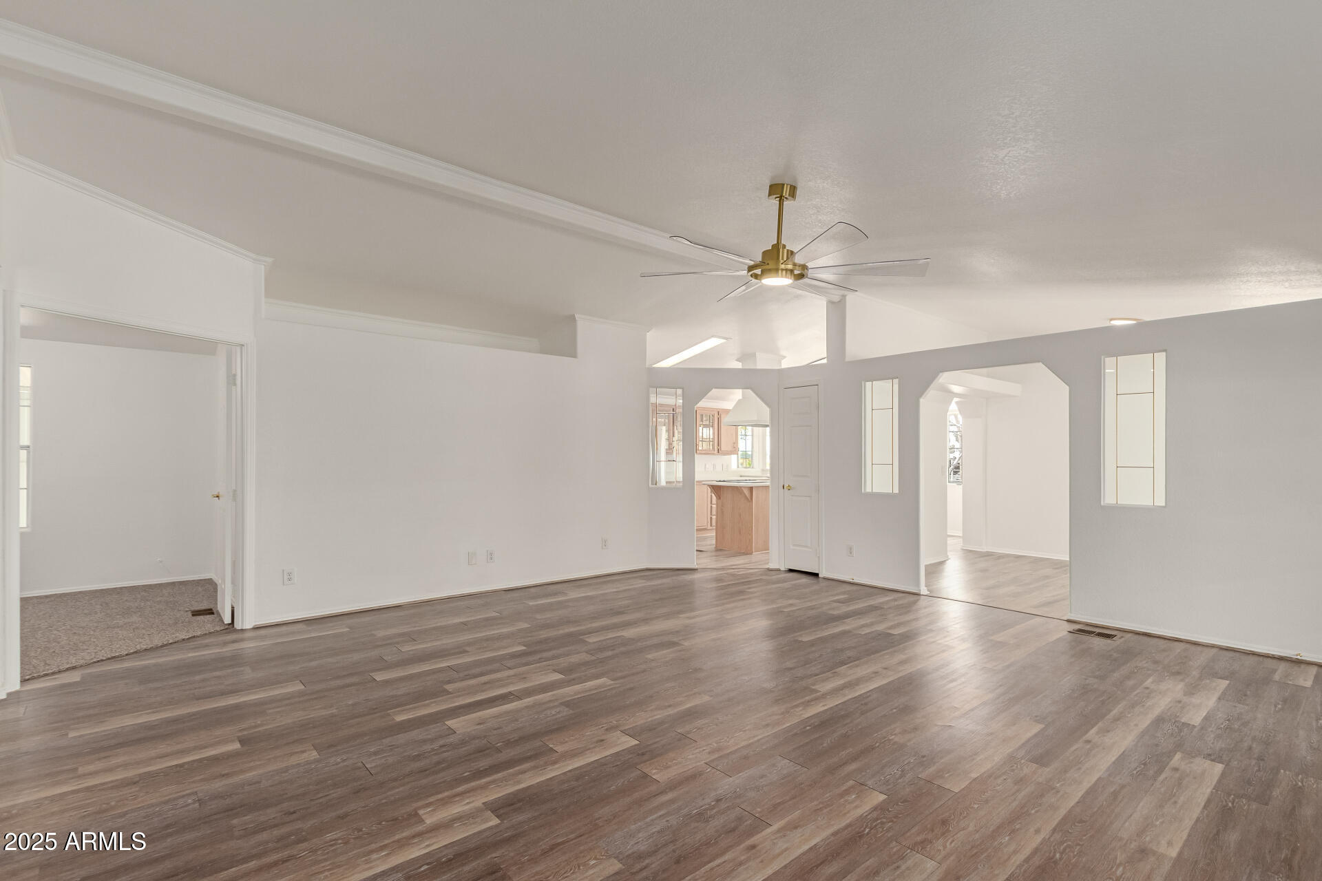 2311 South Descanso Road Apache Junction, AZ 85119 - Photo 3 of 35 a view of an empty room with window and wooden floor