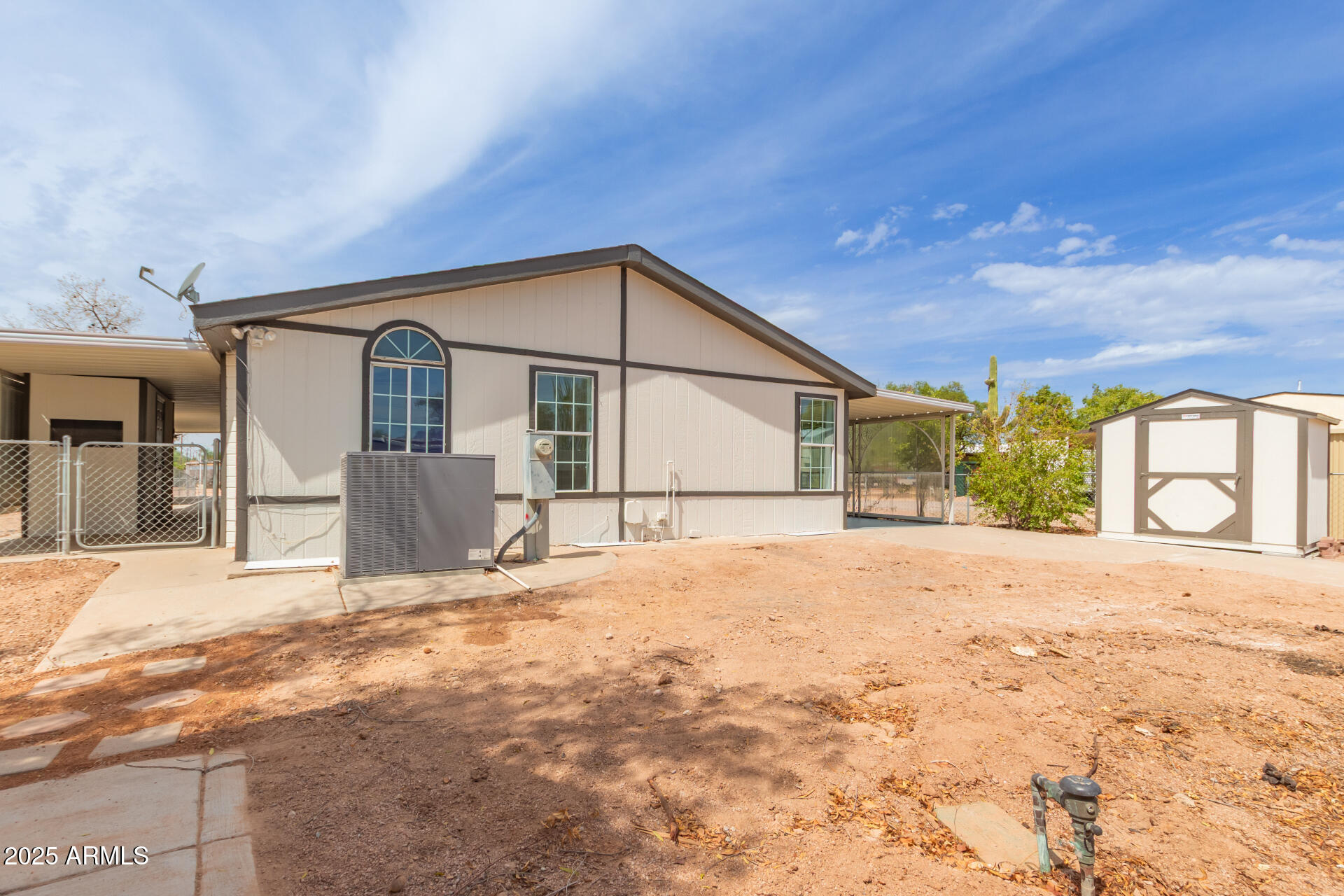 2311 South Descanso Road Apache Junction, AZ 85119 - Photo 35 of 35 a front view of a house with a yard and garage