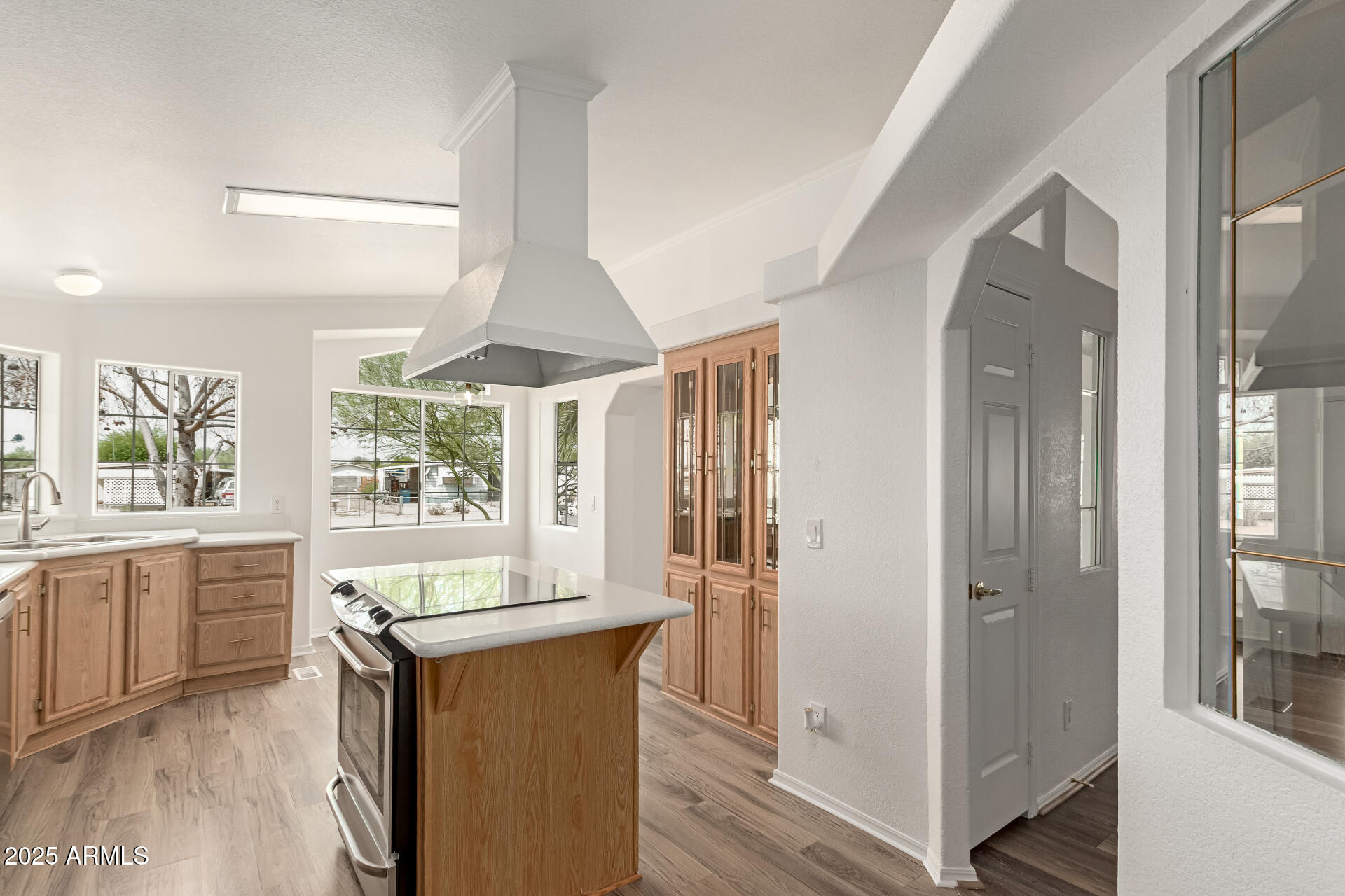 2311 South Descanso Road Apache Junction, AZ 85119 - Photo 10 of 35 a very nice looking room with a large window and wooden floor