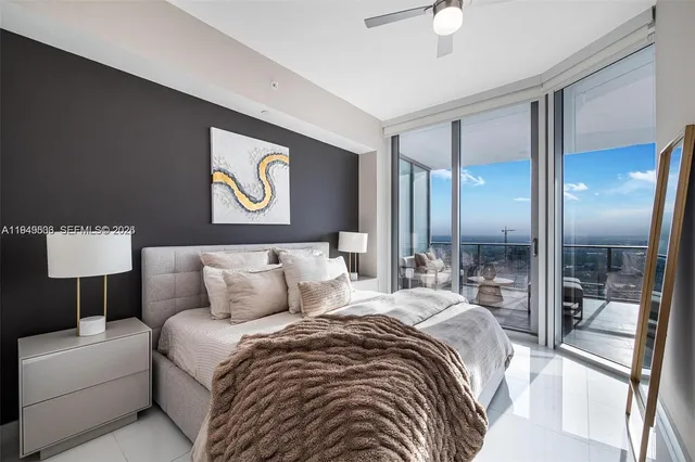 a bedroom with a bed and a lamp