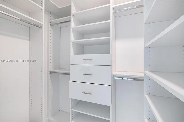 a view of an empty walk in closet